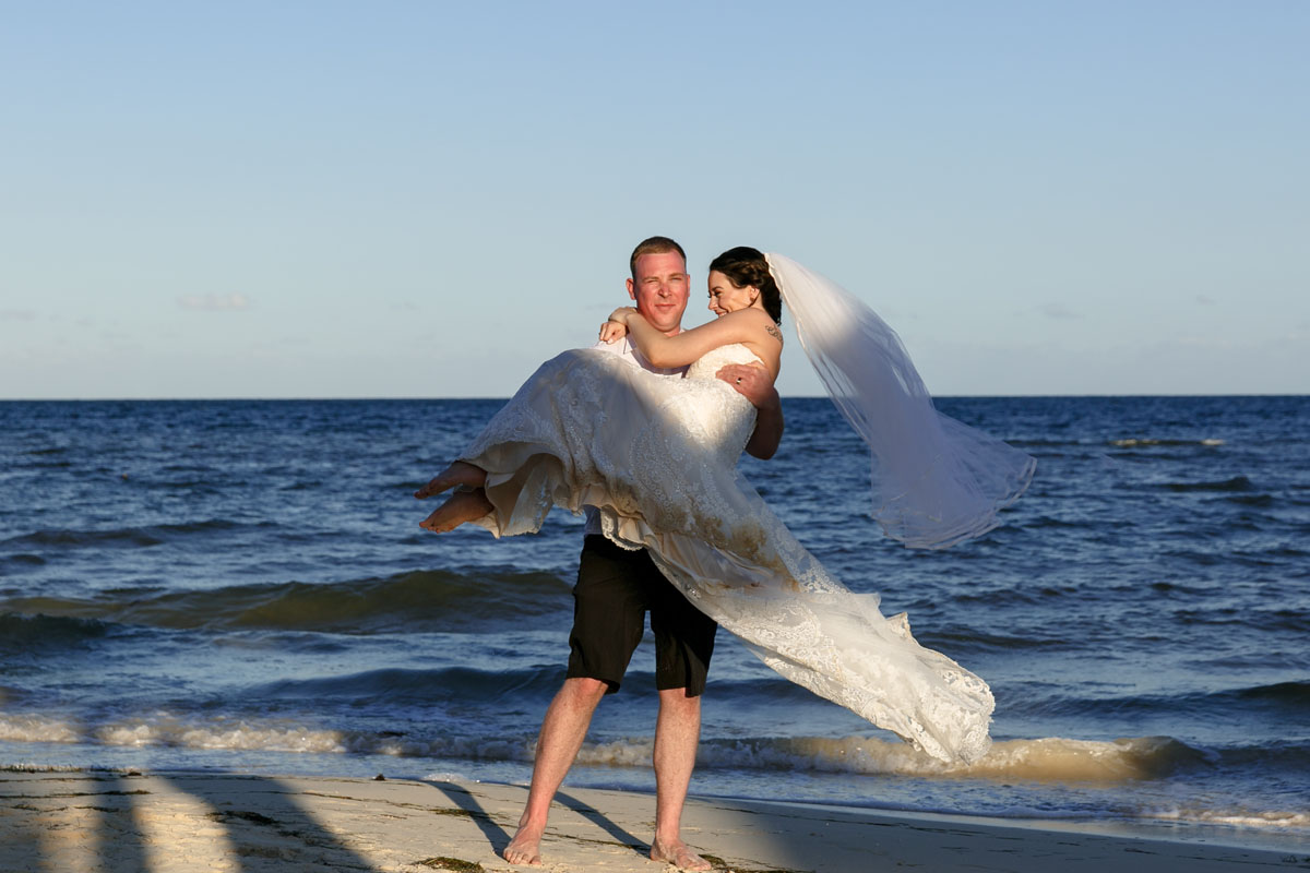 NewlywedsTwirlOnBeach