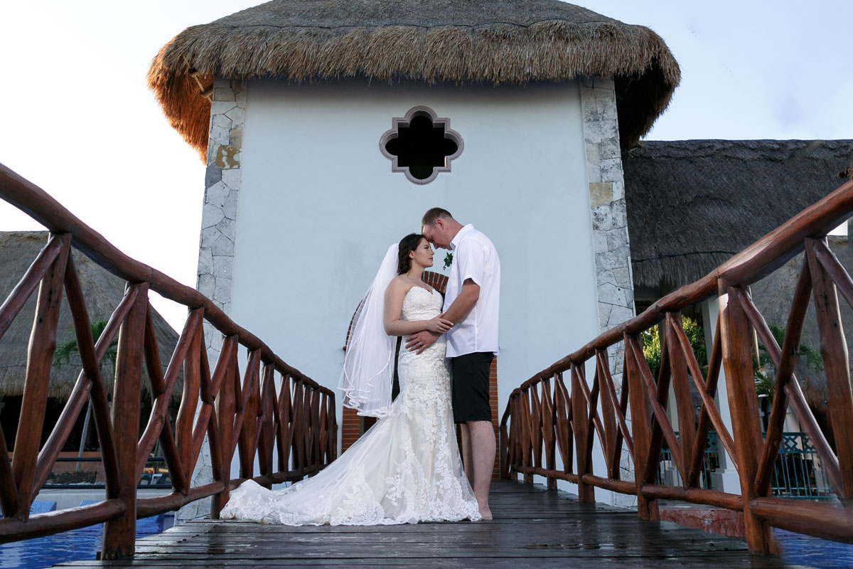 NewlywedsPoseOnPierWalkway