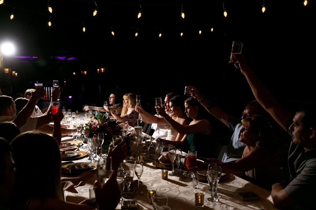 NowSapphireNewlywedsCheerWithReceptionGuests