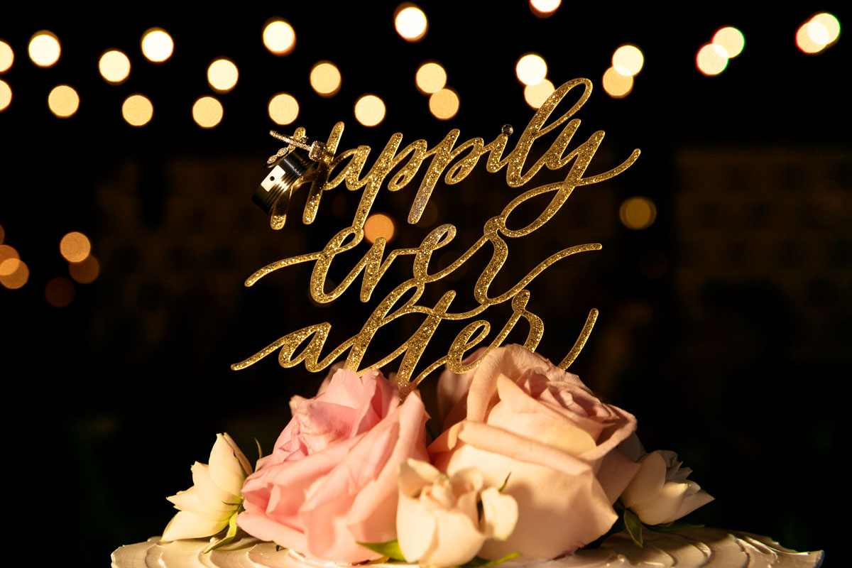 WeddingRingBlingSparklingAtopCake