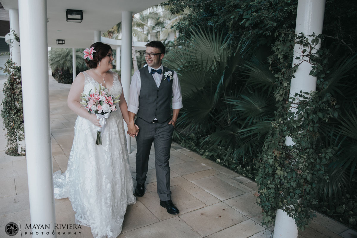 NewlywedsStrollPathHoldingHands