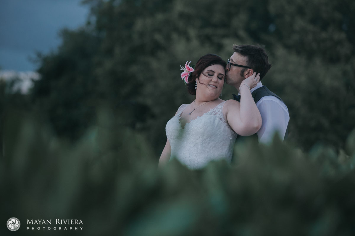 NewlywedsEmbraceInGarden