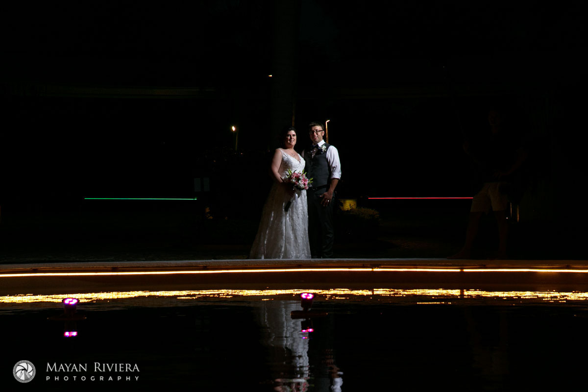 NewlywedsPoseBehindPool