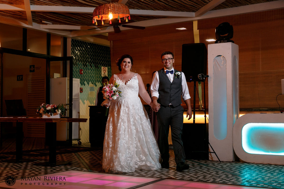 NewlywedsArriveAtReception