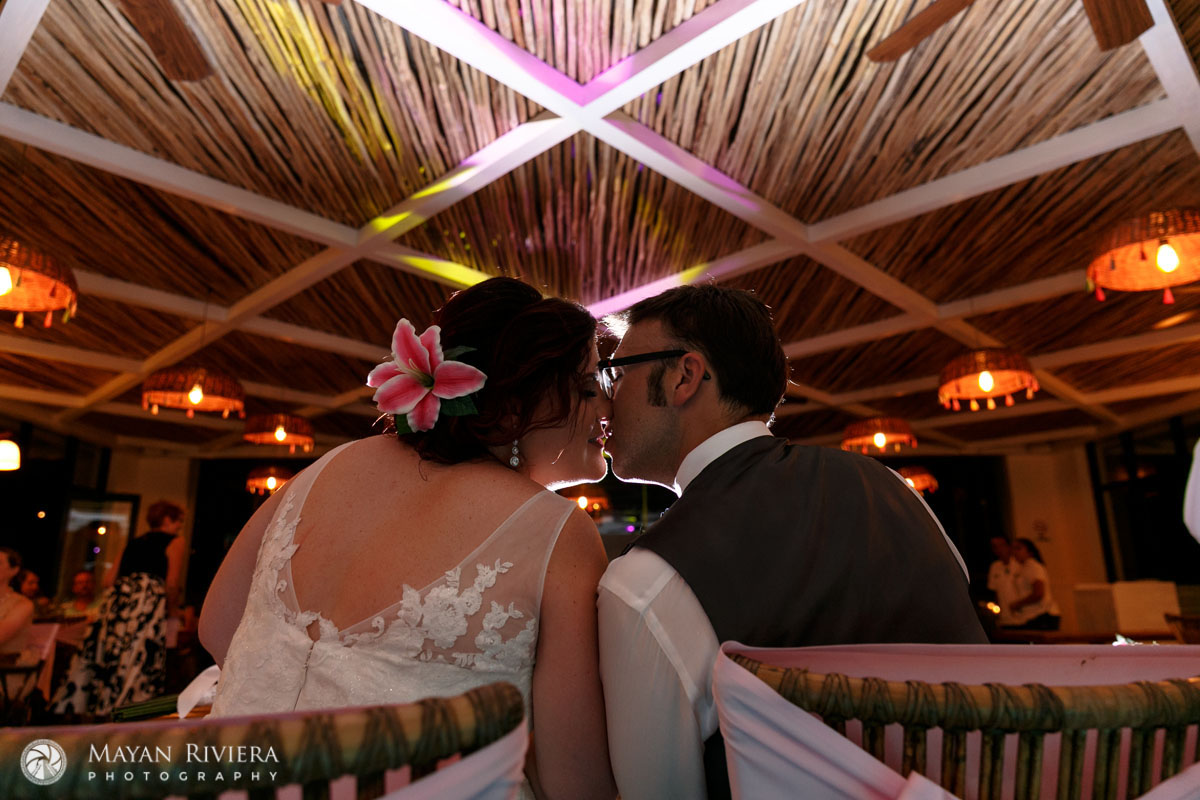 NewlywedsKissAtHeadTable