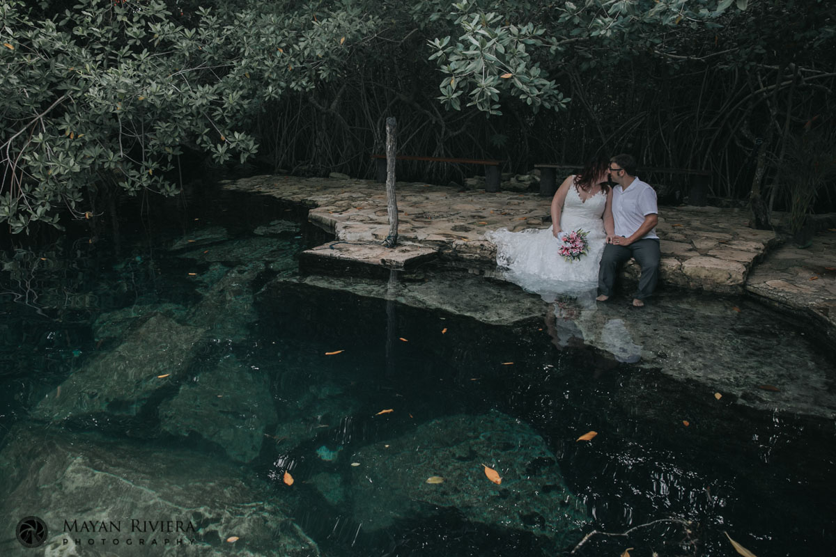 ORPNewlywedsKissAtCenoteEdge