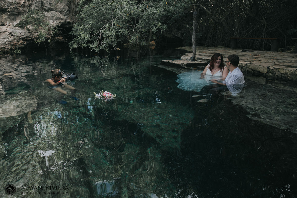 ORPNewlywedsSitAtCenoteEdge