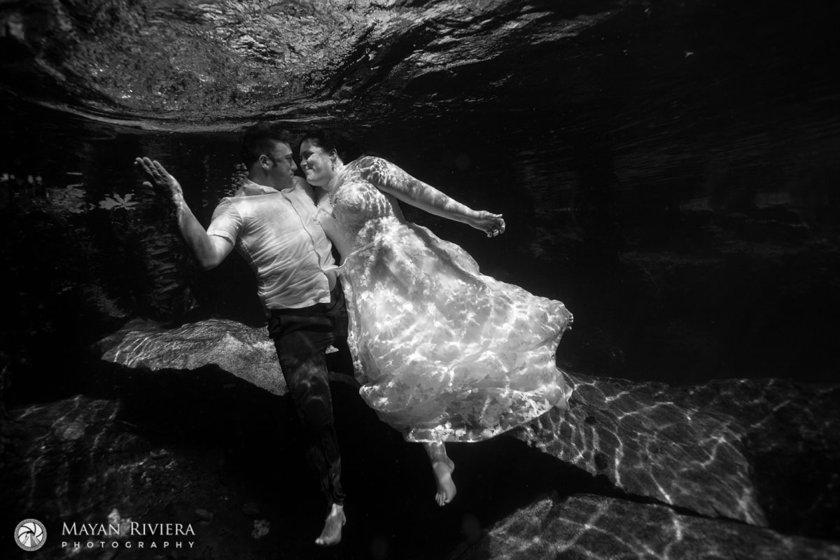 NewlywedsFloatUnderwaterInCenote