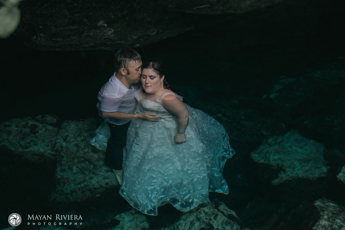 NewlywedsEmbraceInCenoteWater
