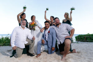 WeddingPartyCheeringOnBeach