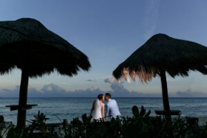 NewlywedsKissOnBeach