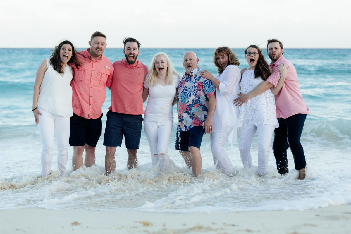 Annette and family surprised in the shallows by an incoming wave