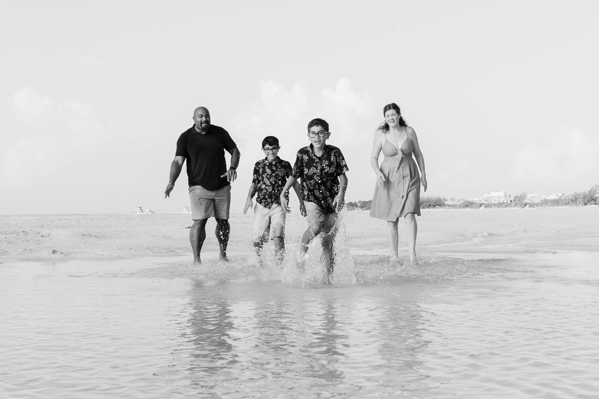 RunningFamilySplashesWaterInTidePool