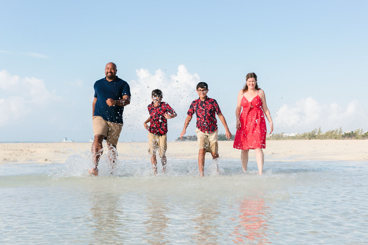 RunningFamilySplashesWaterInTidePool