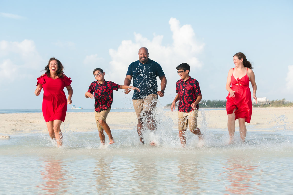 RunningFamilySplashesWaterInTidePoolLaughing