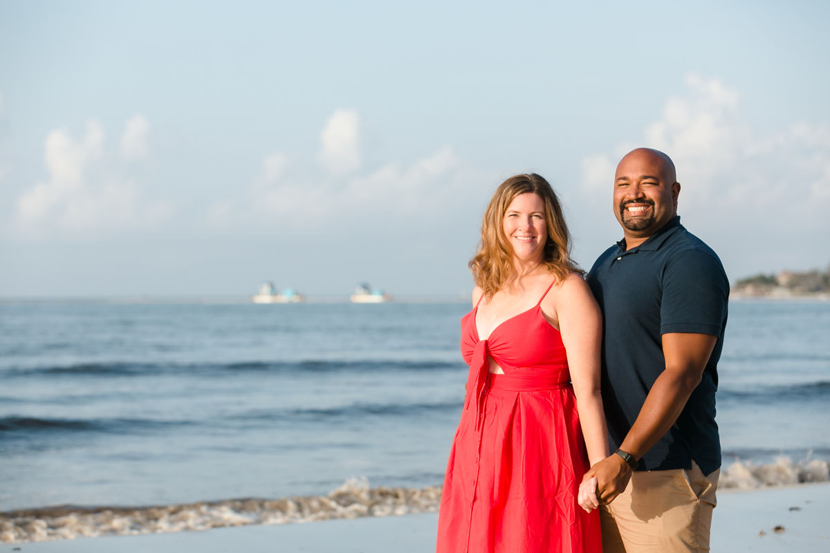 SmilingRyannAndWifeHoldHandsOnBeachAtPuntaEsmeralda