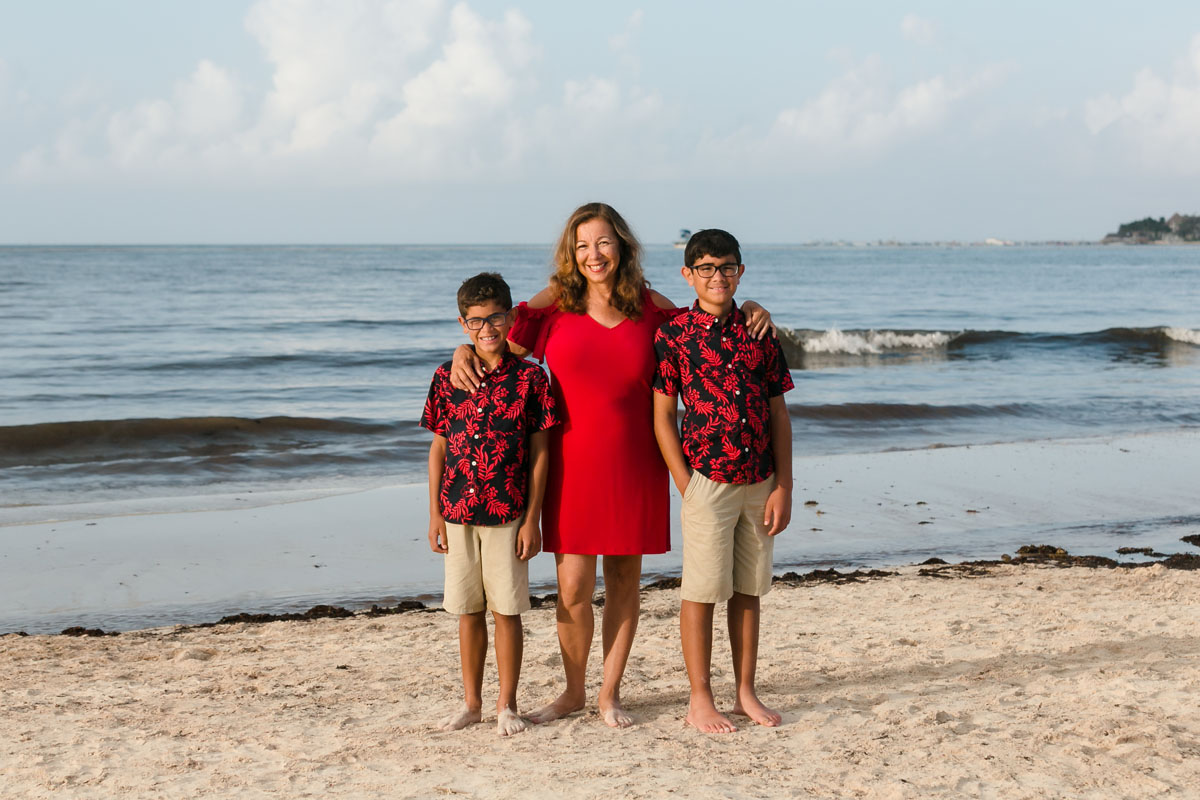SmilingNephewsPoseWithAuntieOnBeach
