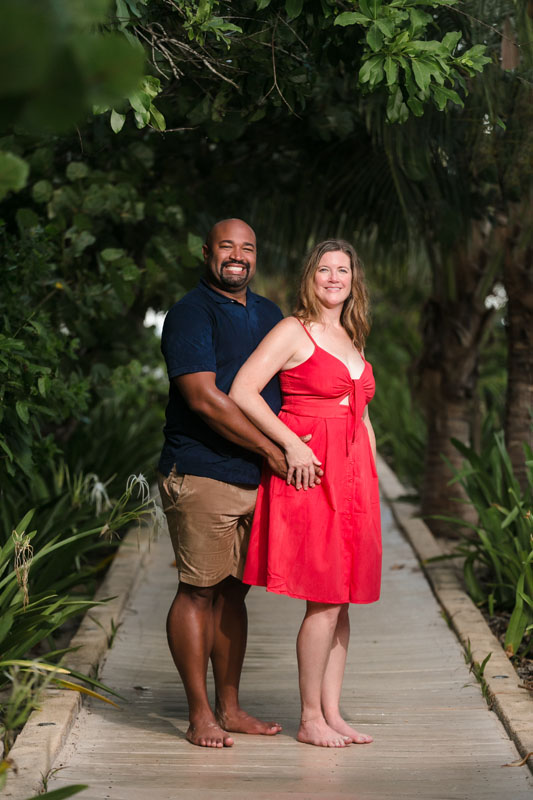 RyannAndWifePoseOnJunglePathwaySmiling