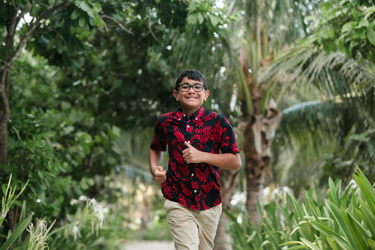 BoyRunsOnJunglePathwayAtPuntaEsmeralda