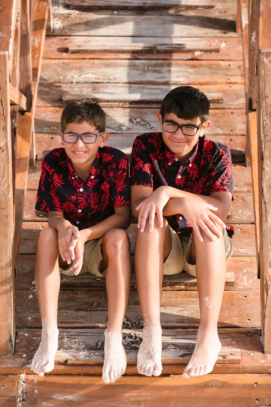 SmilingBoysSitOnLifeGuardTowerSteps