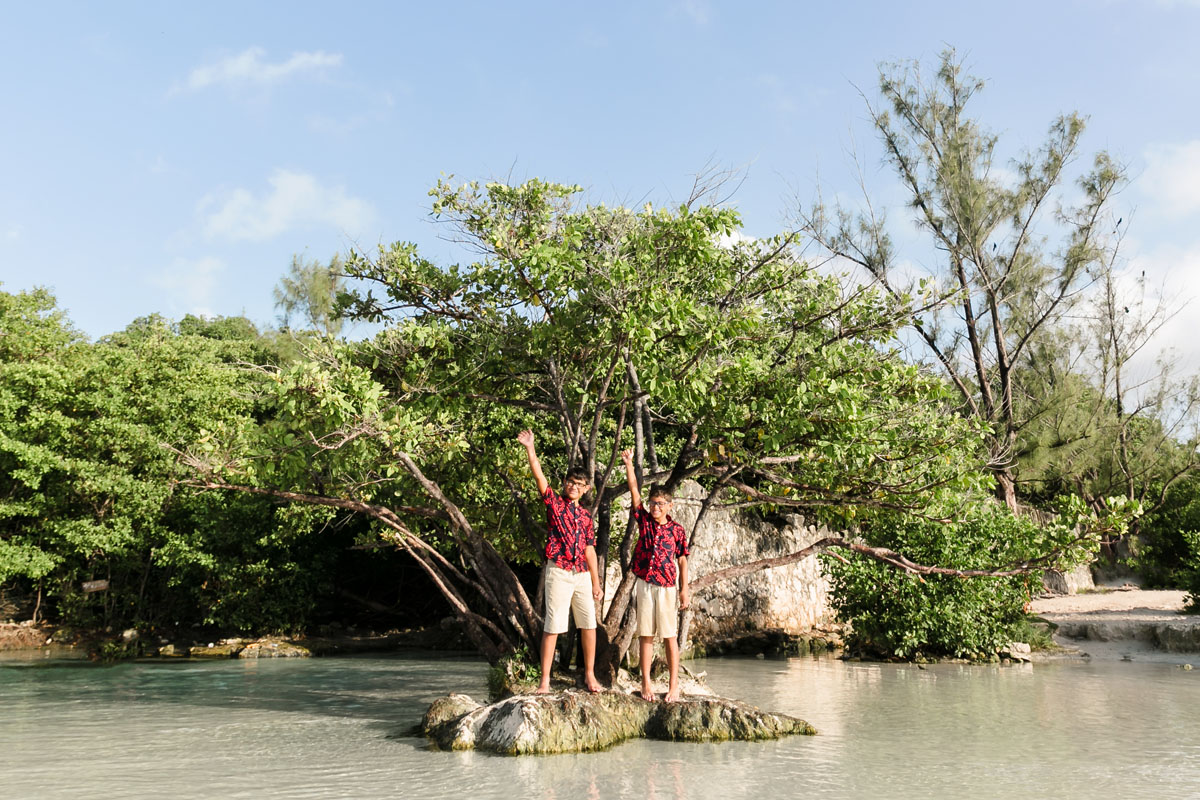 BoysWaveFromTinyIslandByJungleTree