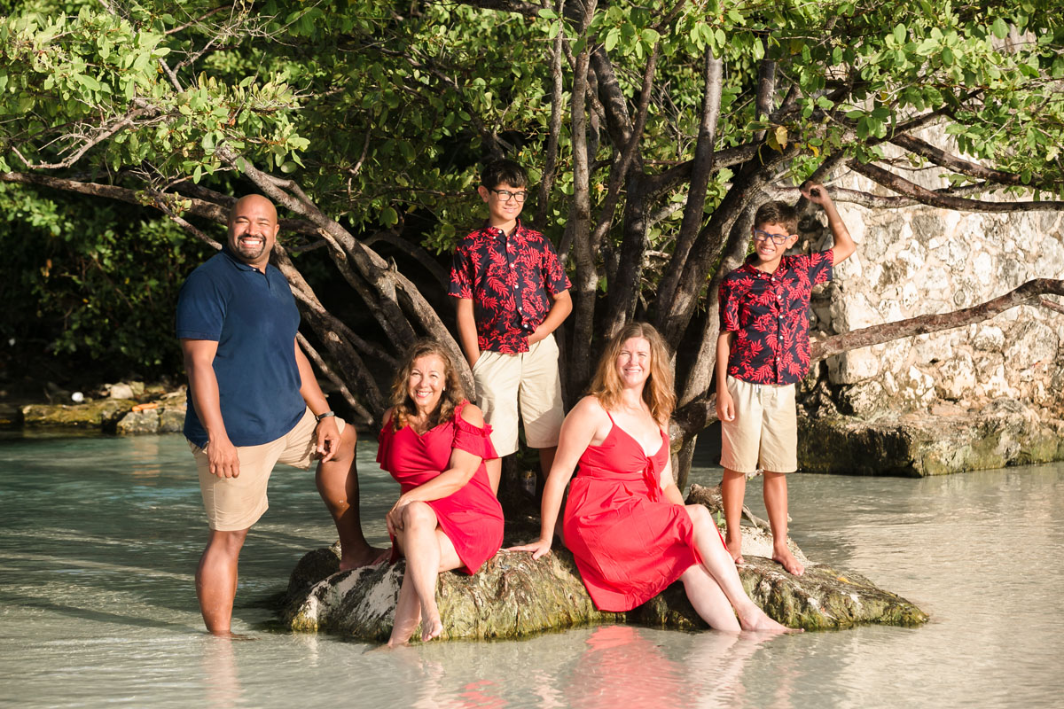 FamilyPosesOnTinyIslandByJungleTree