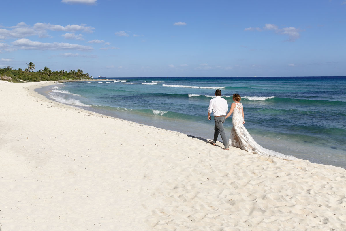 NewlywedsOnBeachWalk