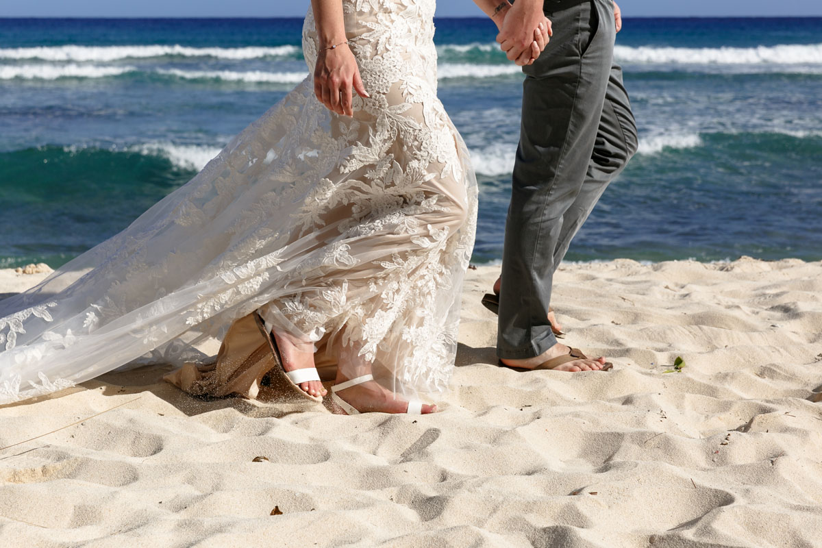 NewlywedsOnBeachWalk