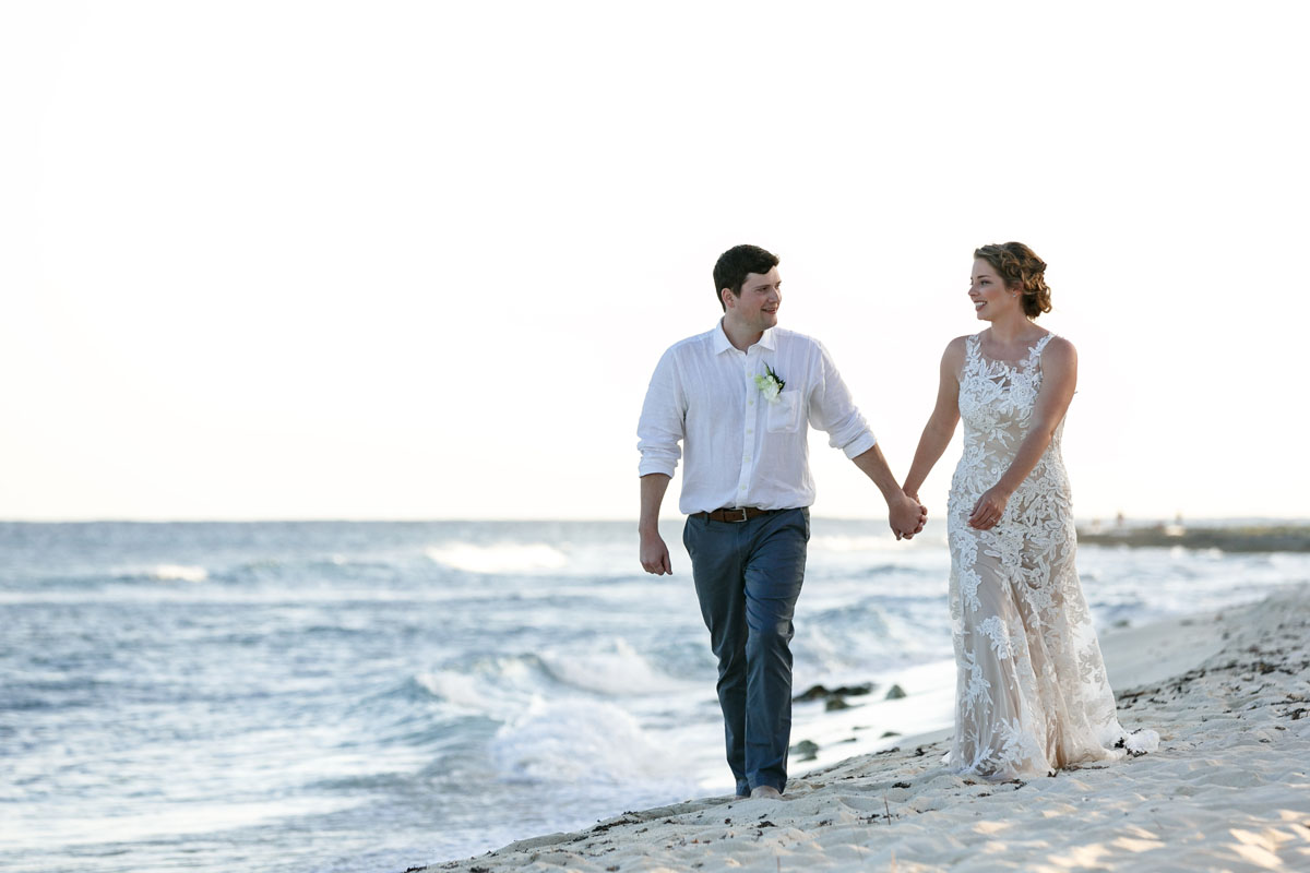 NewlywedsOnBeachWalk