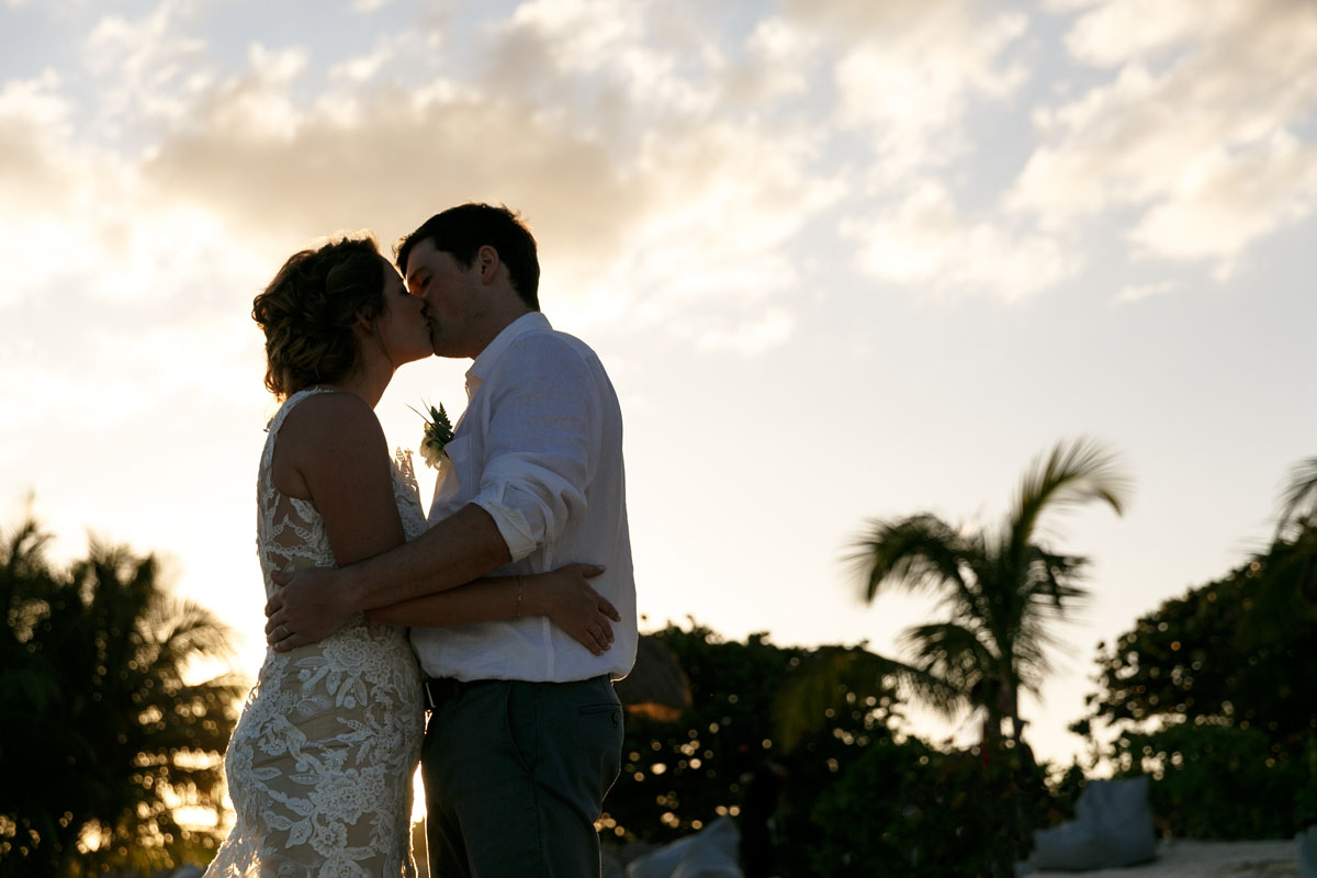 NewlywedsKissInSunsetGlow