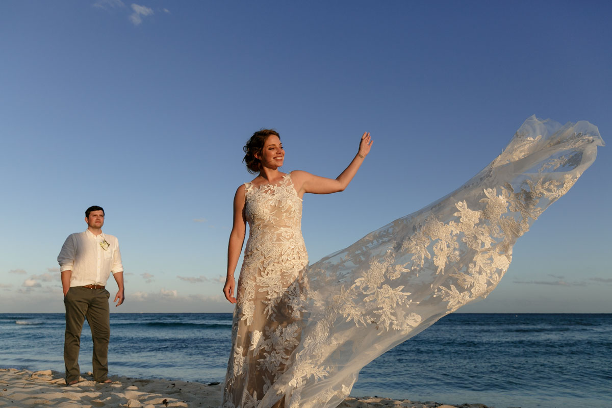 NewlywedsPoseOnBeach