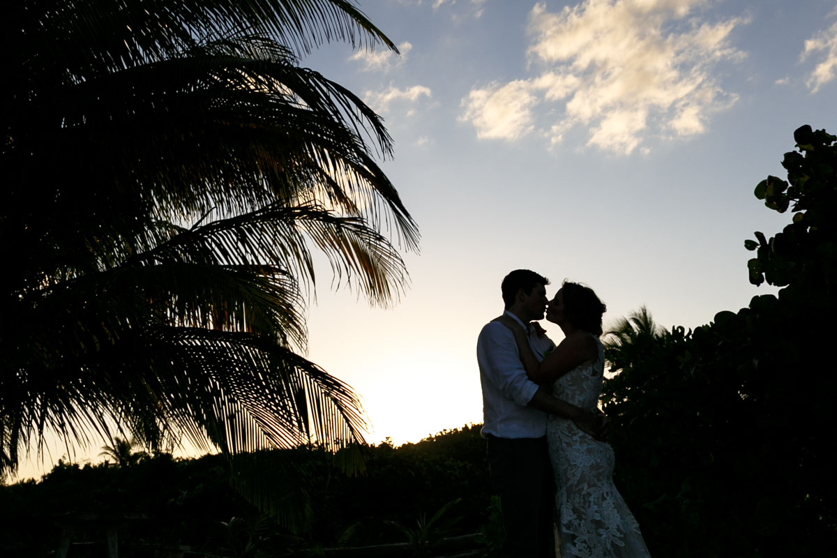 NewlywedsEmbraceInSunsetGlow