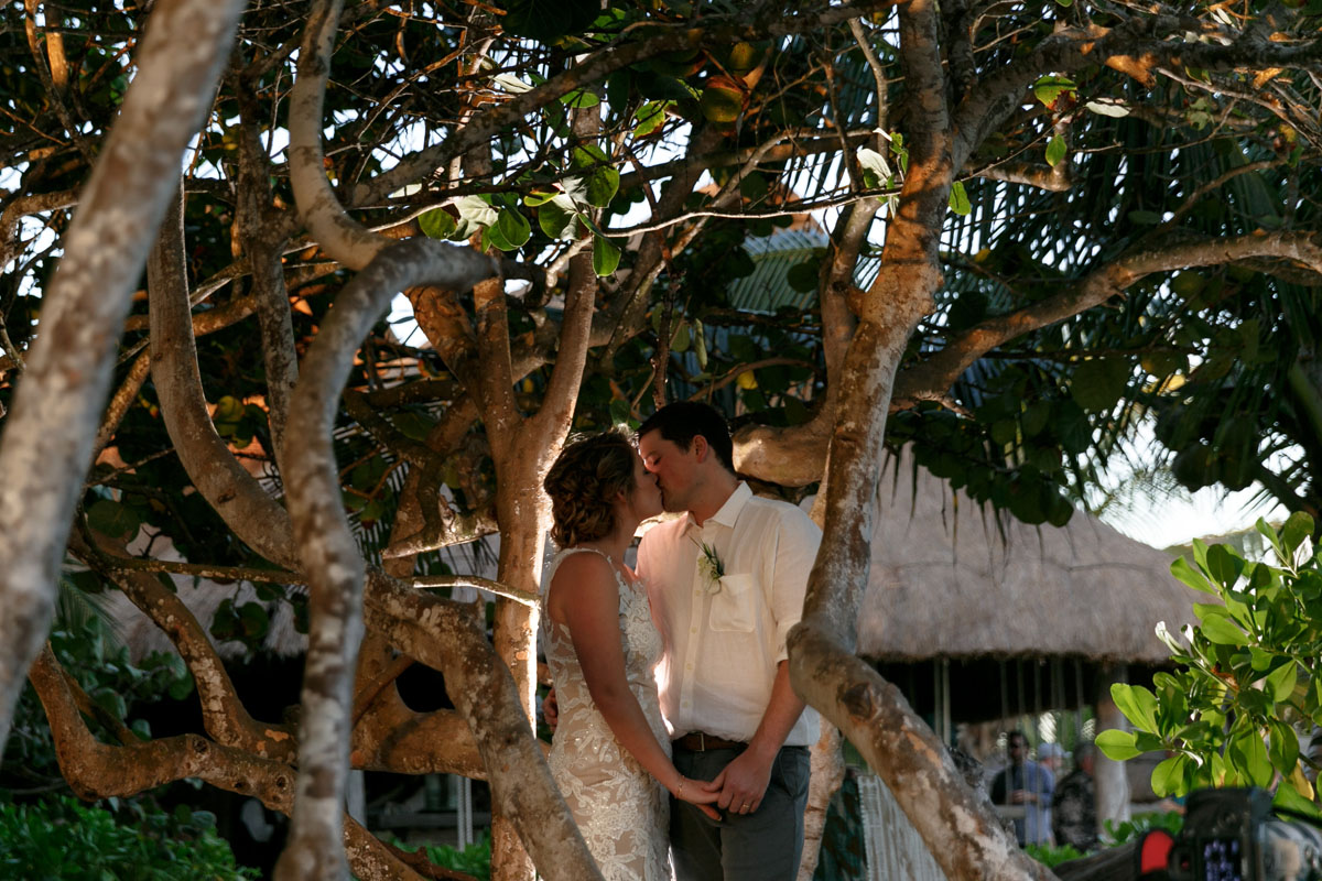 NewlywedsKissInSunsetGlow