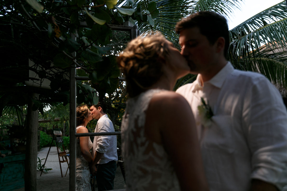 NewlywedsKissReflectedInMirror