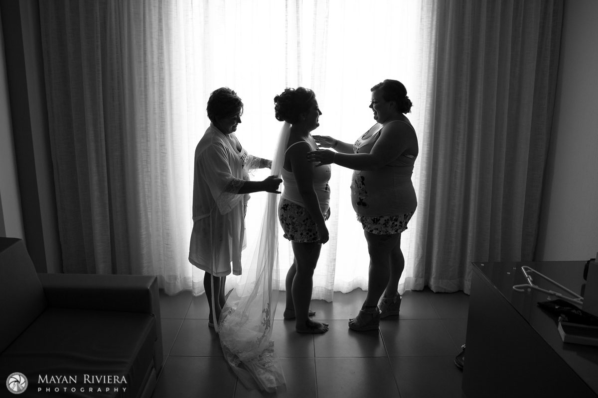 BridesTeamHelpingHerDress