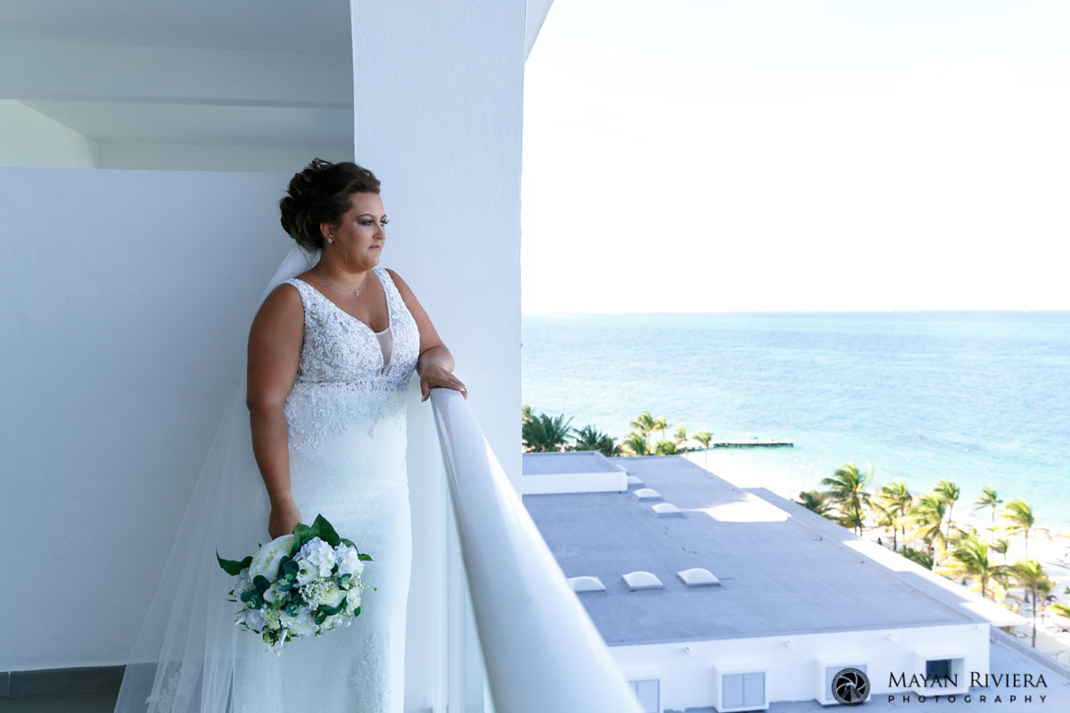 BrideCarlyOnBalconyLookingOutToSea