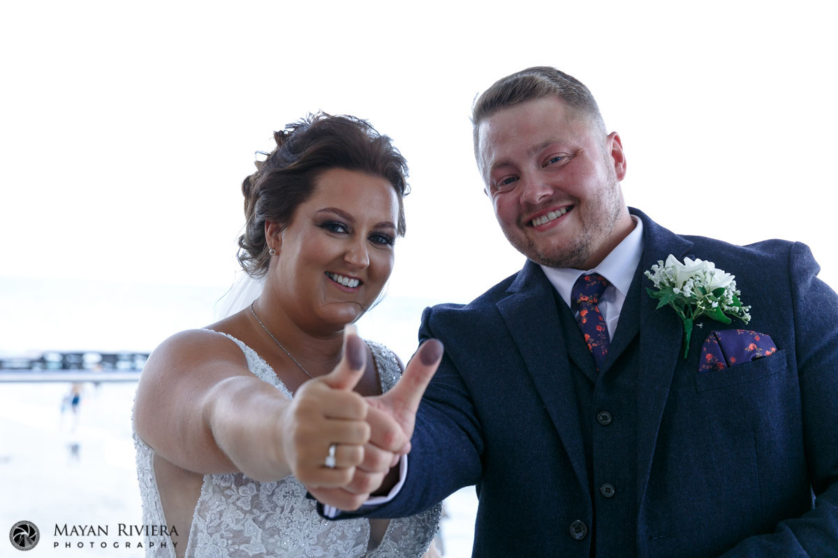 WeddingCoupleShowingInkyThumbprints