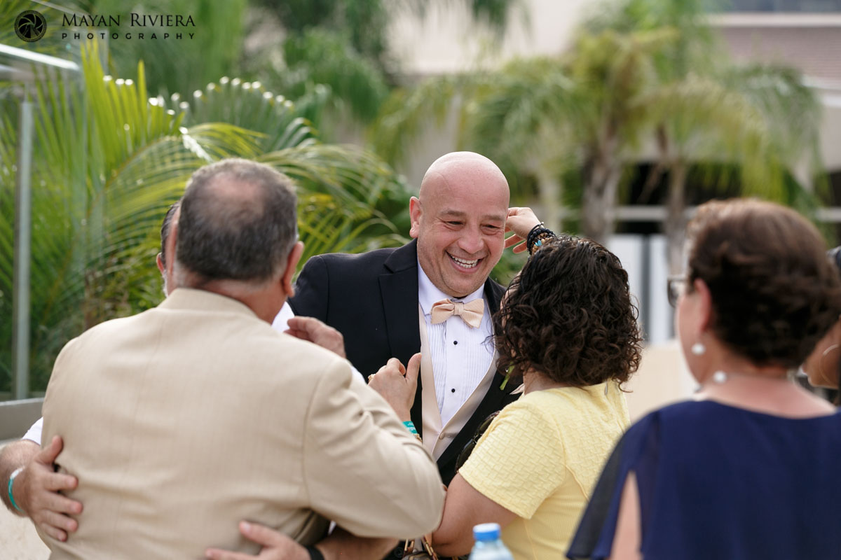 GroomLaughsWithGuests