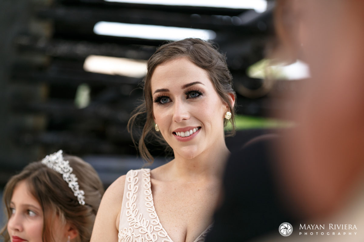 BridesmaidSmilesAtCeremony