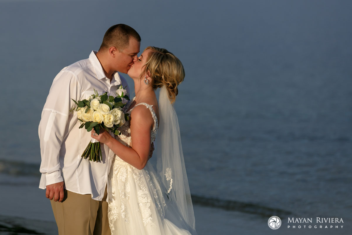 NewlywedsKissOnBeach