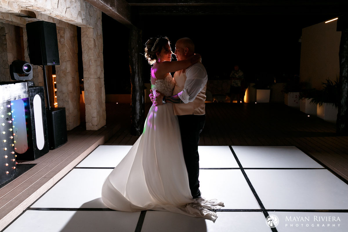 NewlywedsEmbraceInADance