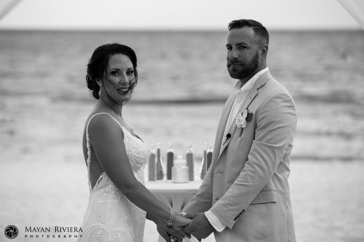 AzulFivesCoupleHoldHandsAtCeremony