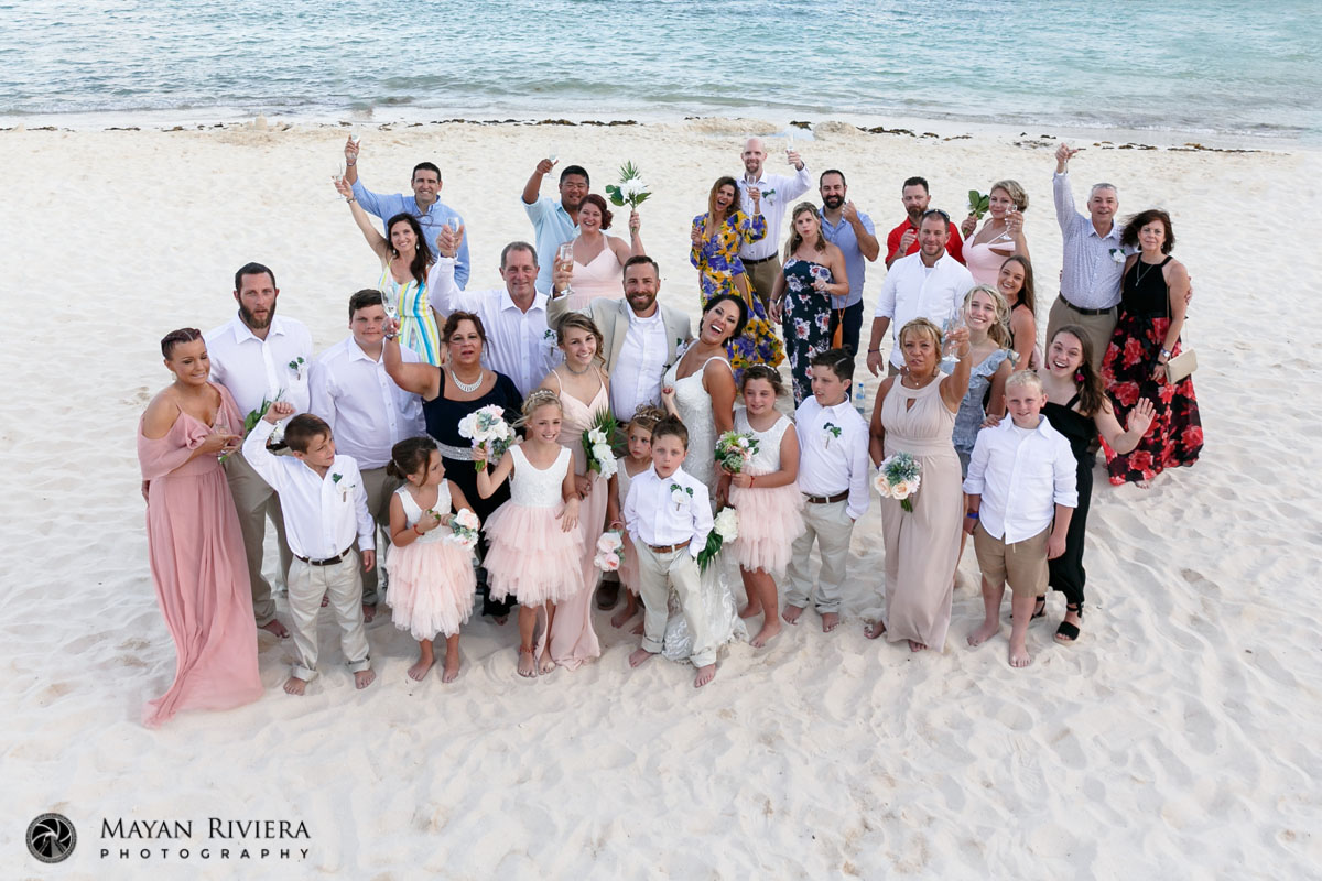 NewlywedsCheerWithGuestsRaisingArms