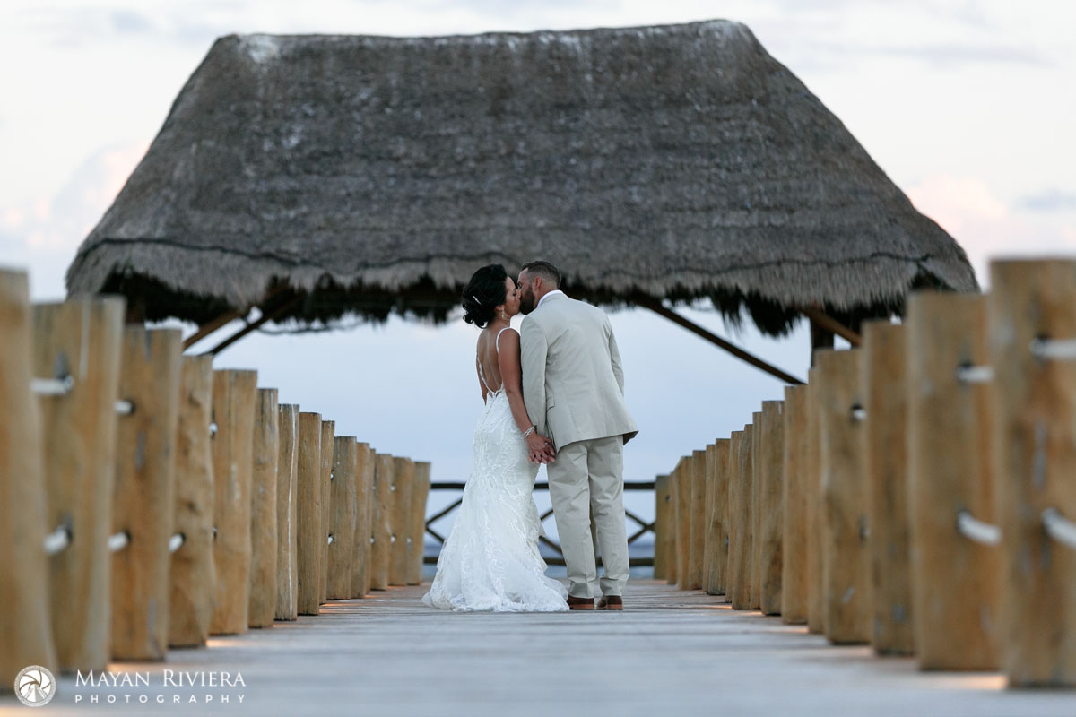 NewlywedsKissOnPier