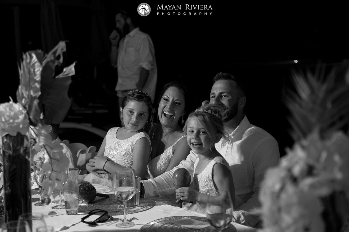 NewlywedsLaughWithKidsAtHeadTable