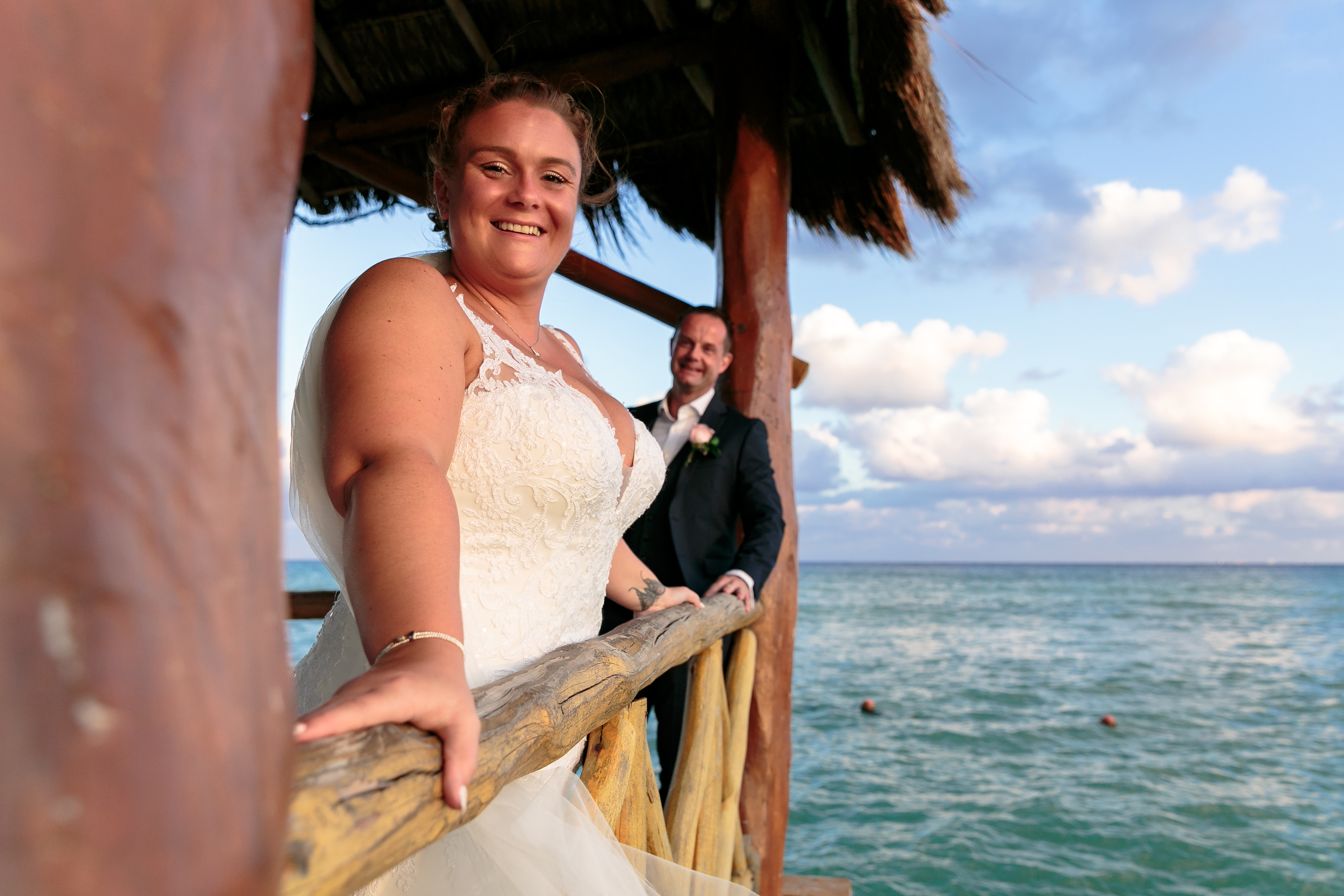 AzulBeachNewlywedsPoseOnPier