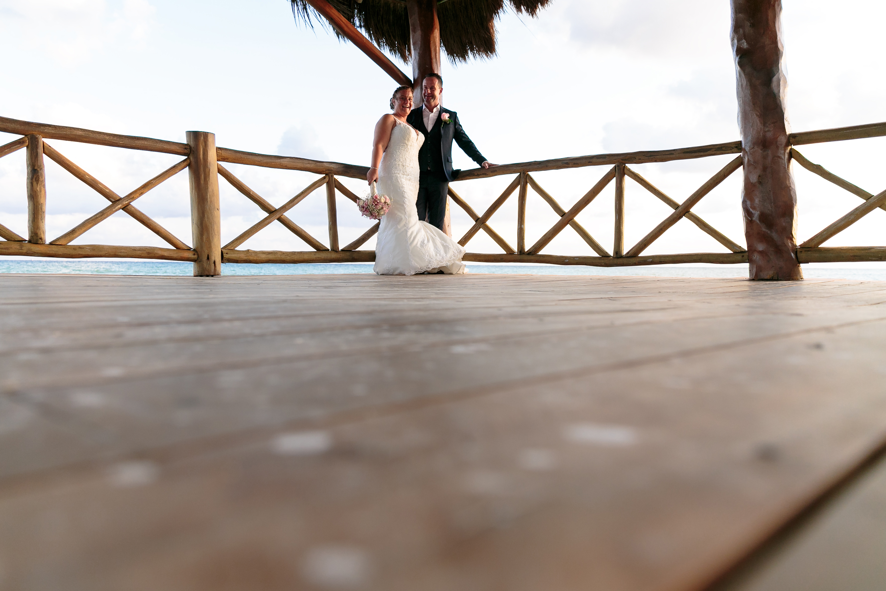 AzulBeachNewlywedsPoseOnPier