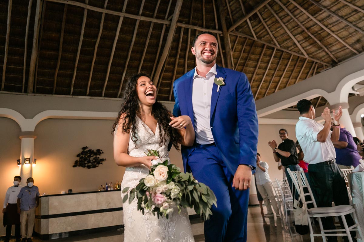 Newlyweds arrive at reception laughing