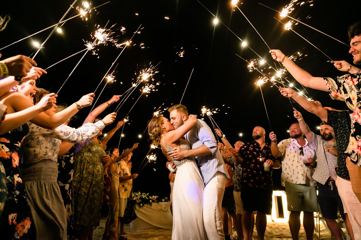 SandosPlayacarNewlywedsKissInSparklerGauntlet