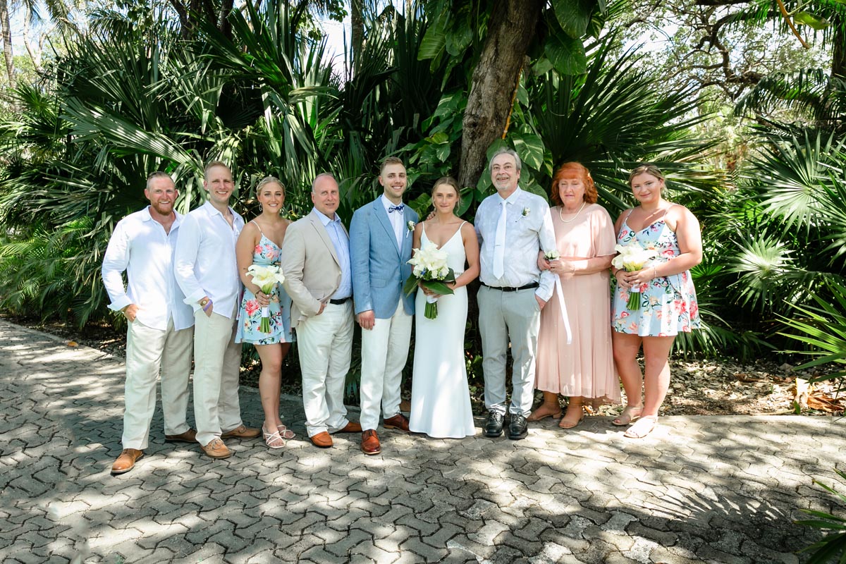 NewlywedsPoseWithFamily